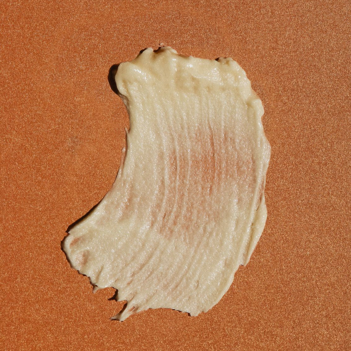 Close-up texture swatch of Nudea Tallow Balm on skin-toned background — rich, natural ancestral skincare