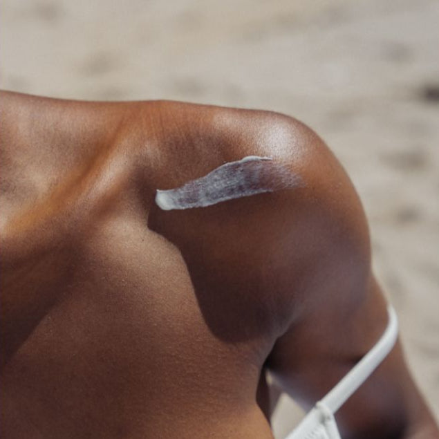 Nudea tallow balm applied on sun-kissed skin — natural, ancestral skincare for deep nourishment